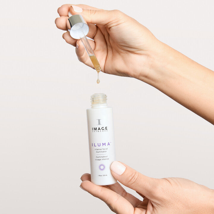 Model holding ILUMA Facial Illuminator