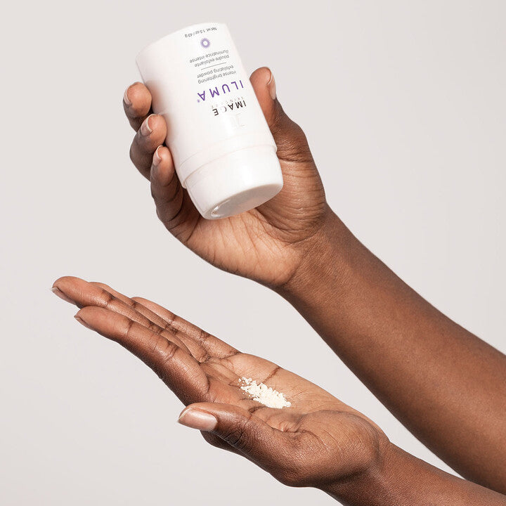 Model showing ILUMA Intense Brightening Exfoliating Powder on hand