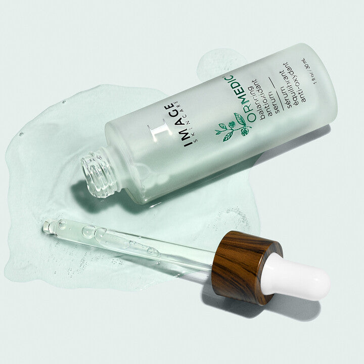 ORMEDIC Balancing Antioxidant Serum open bottle and product swatch