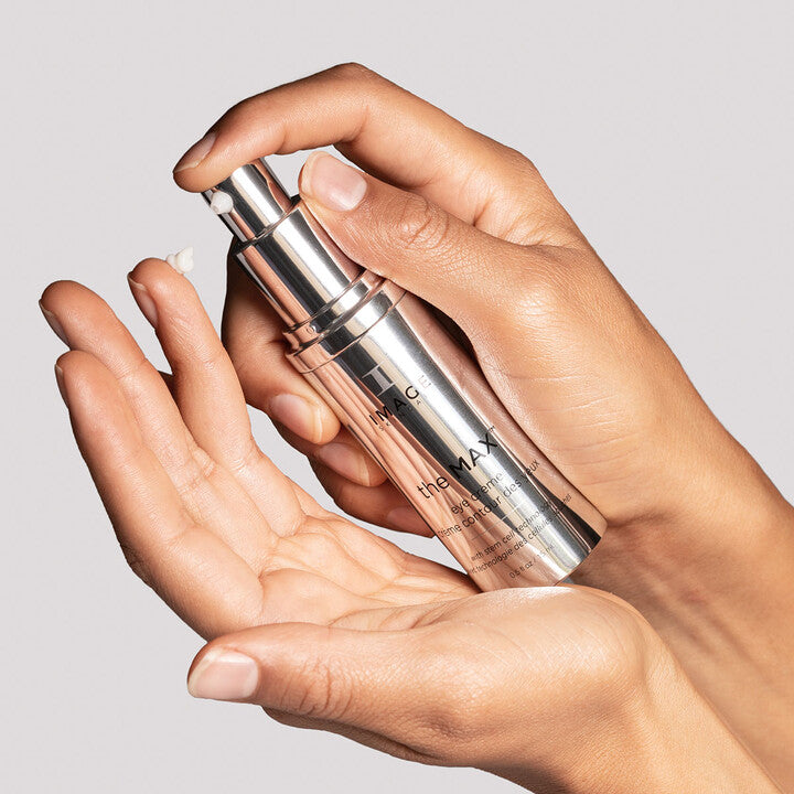 Model applying The MAX Eye Crème on finger
