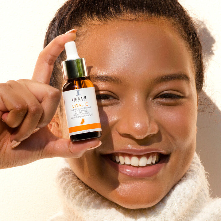 Model holding VITAL C Hydrating Antioxidant ACE Serum