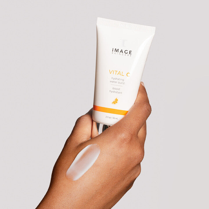 Model showing VITAL C Hydrating Water Burst product on hand